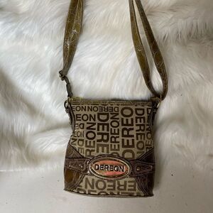 - Deréon khaki and brown canvas & faux leather embossed crocs prints cross…